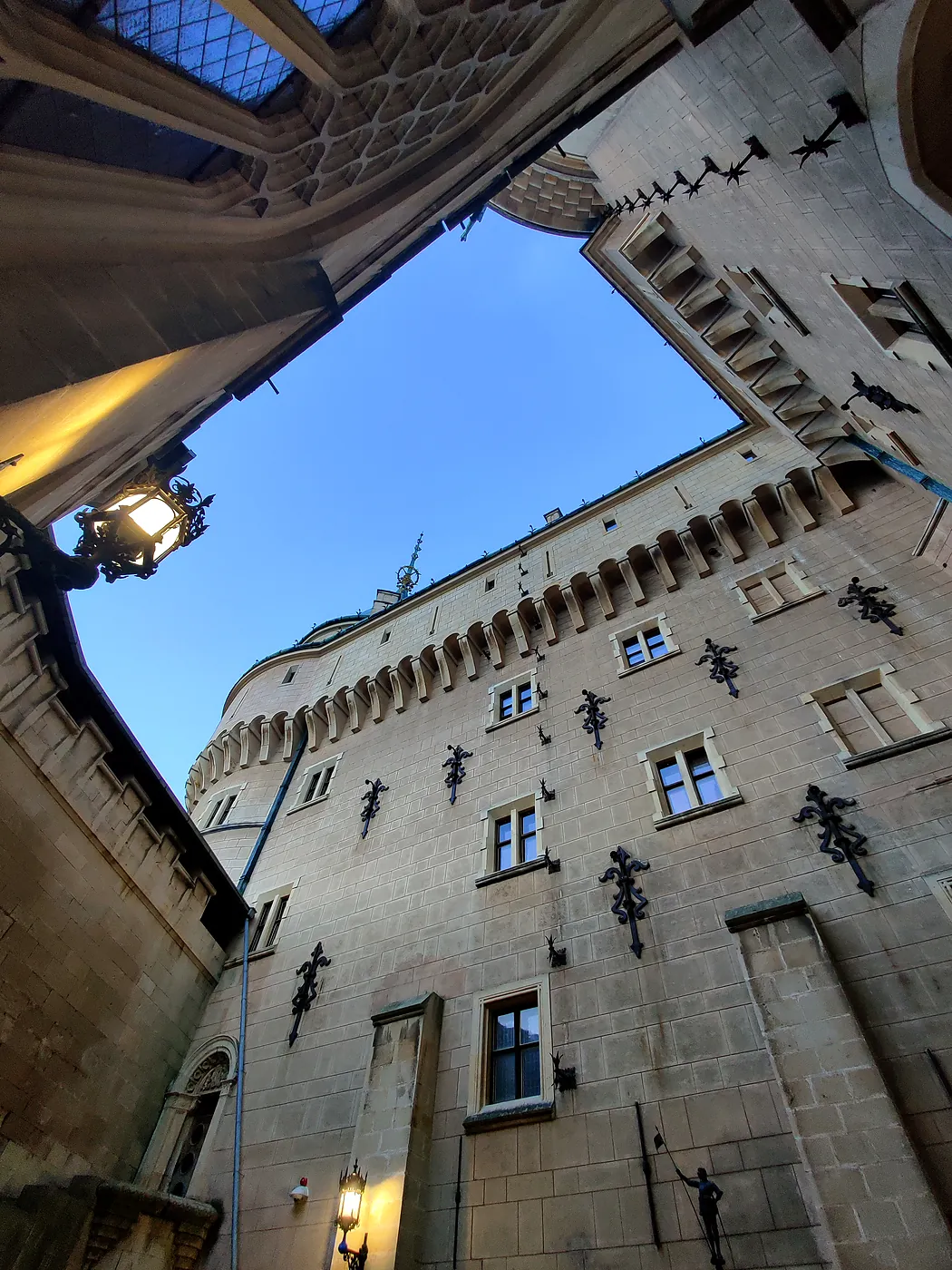 The courtyard of Bojnice Castle with a tower seen from below